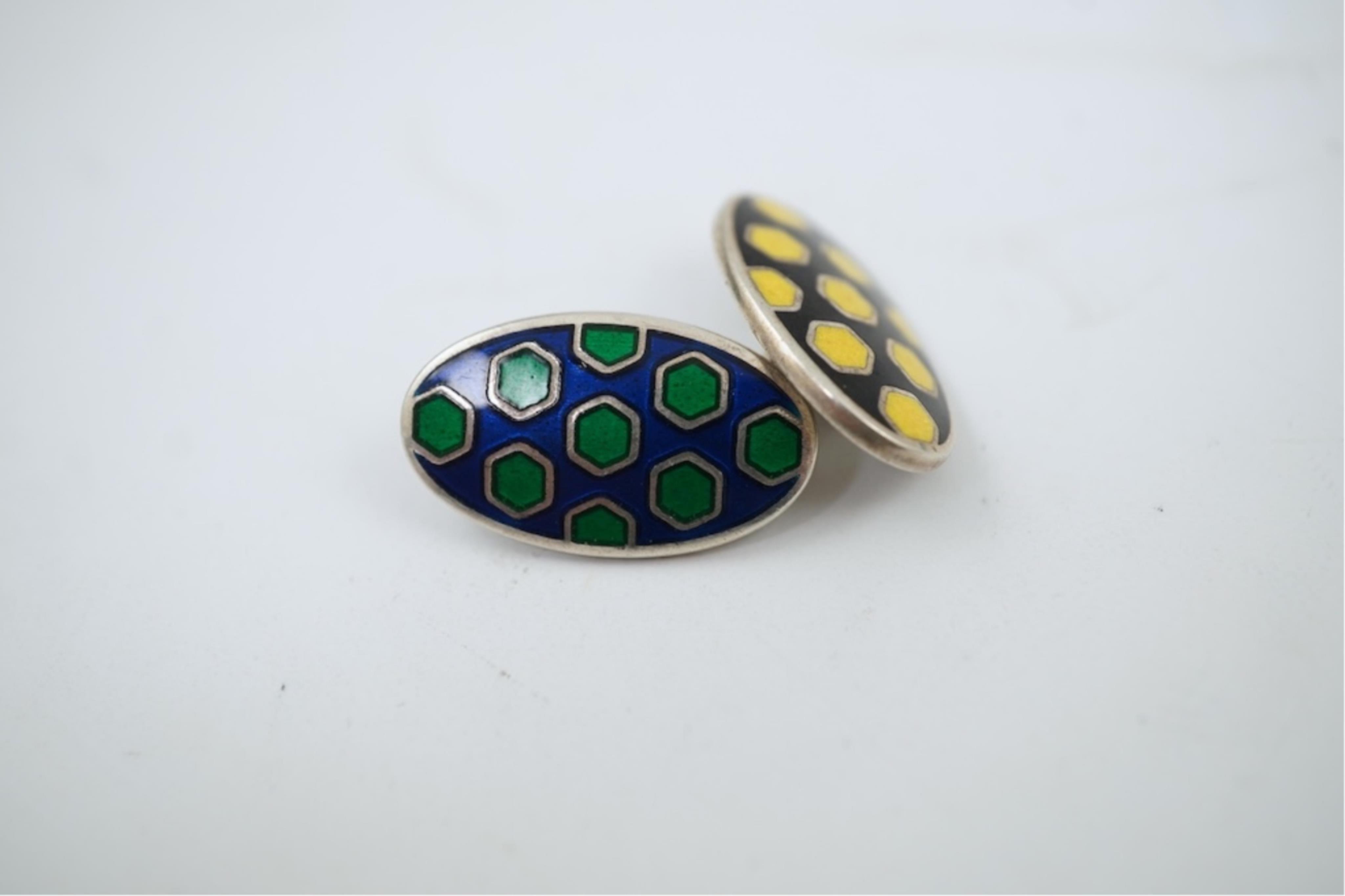 A modern pair of silver and polychrome enamel set oval cufflinks, 18mm.